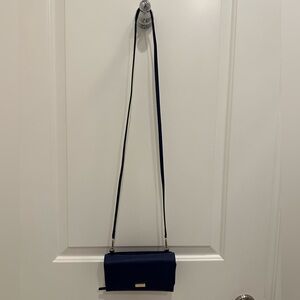 Small Navy Kate Spade Purse with strap.